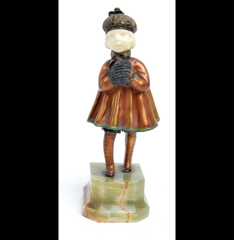 DEMETRE CHIPARUS (1886-1947); a 1920s ivory, gilt and cold painted bronze figure of girl in cape and hat with muff. 