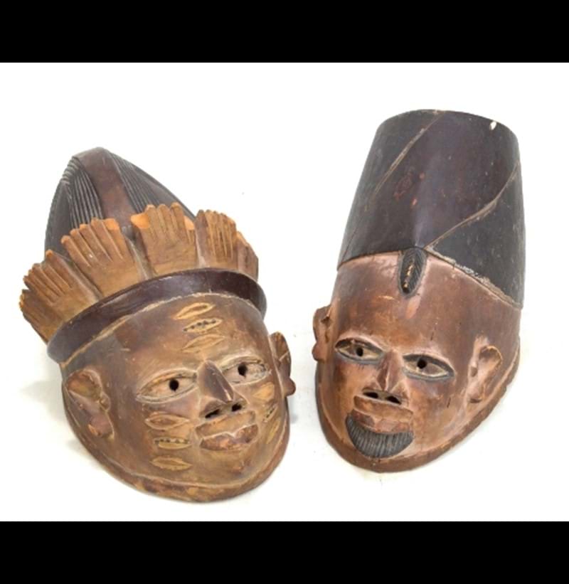 A pair of African wooden tribal masks.
